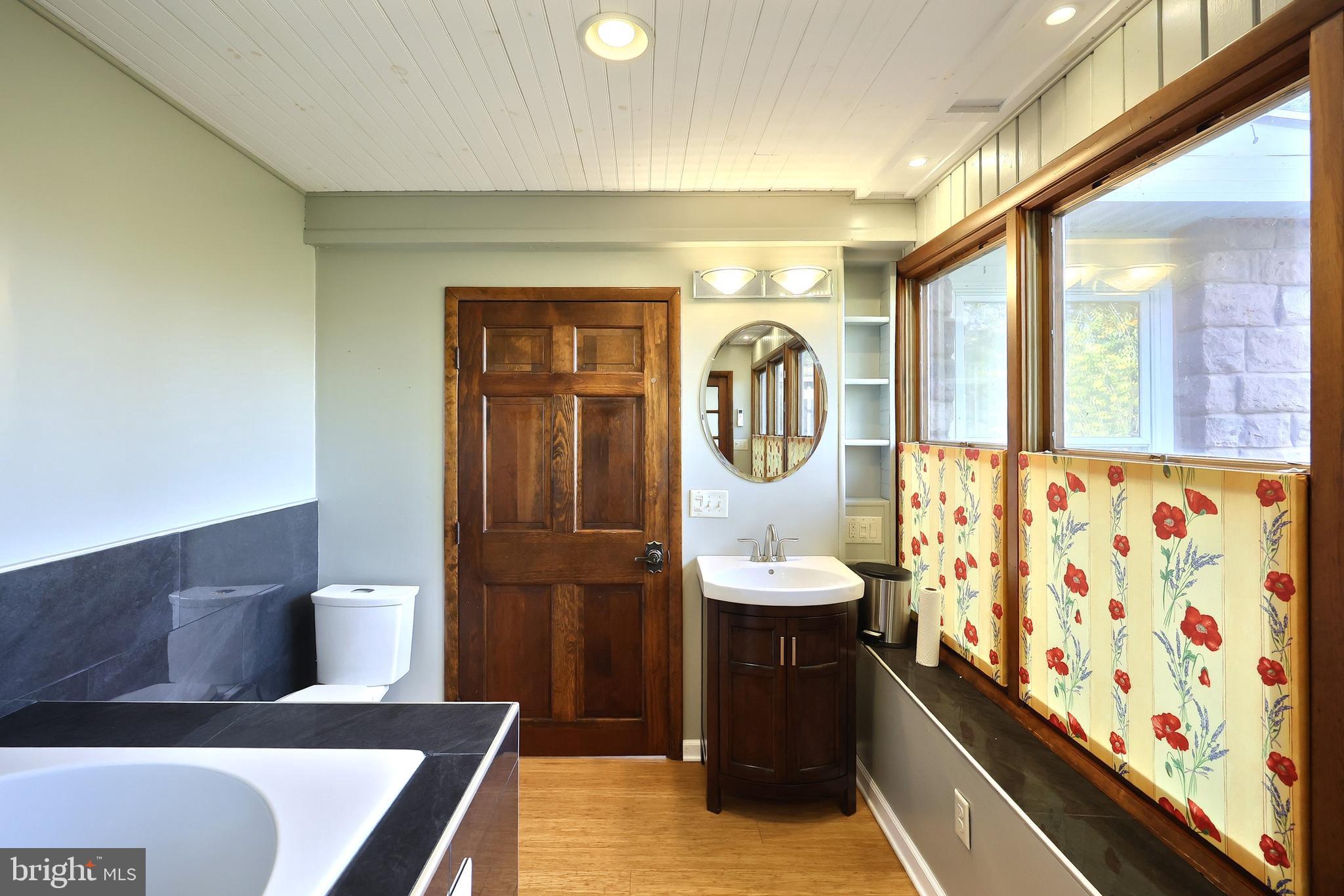 6691 Harmony Grove Road Dover, PA 17315 - Photo 24 of 66 a bathroom with a sink a toilet and tub