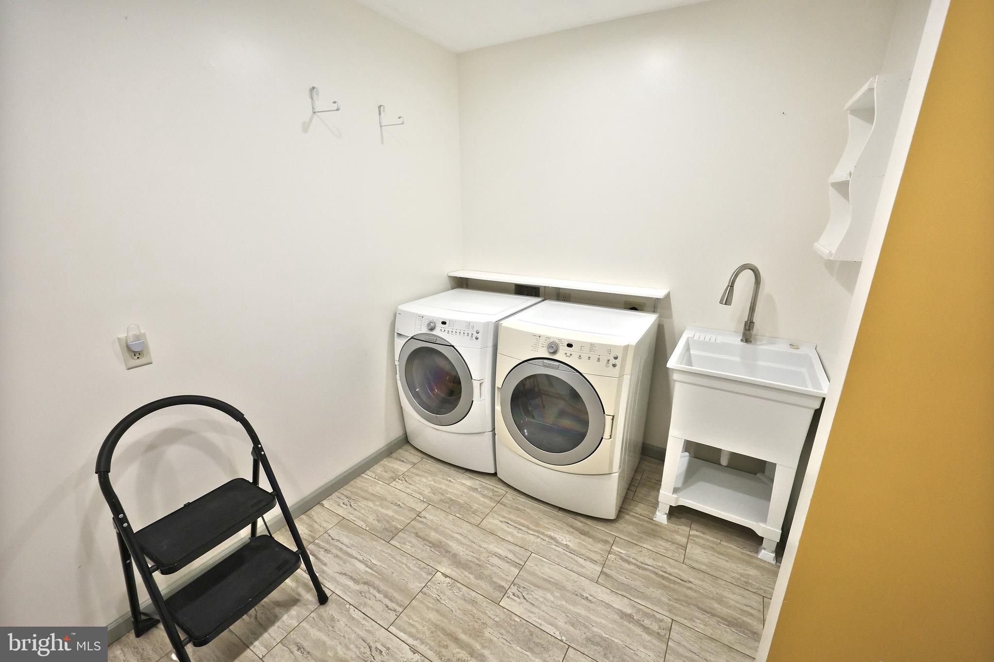 6691 Harmony Grove Road Dover, PA 17315 - Photo 28 of 66 a utility room with dryer and washer
