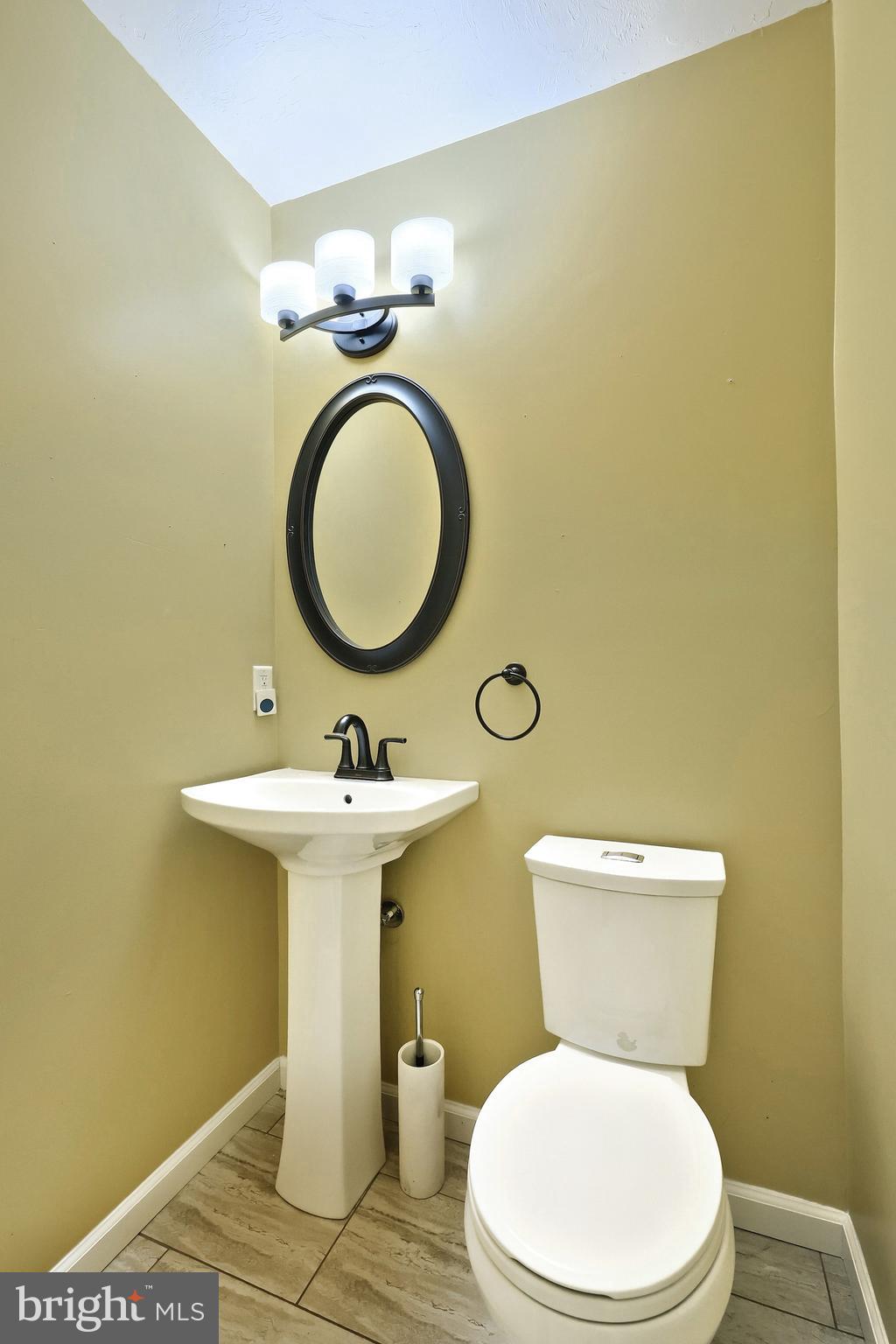 6691 Harmony Grove Road Dover, PA 17315 - Photo 29 of 66 a bathroom with a sink and a toilet