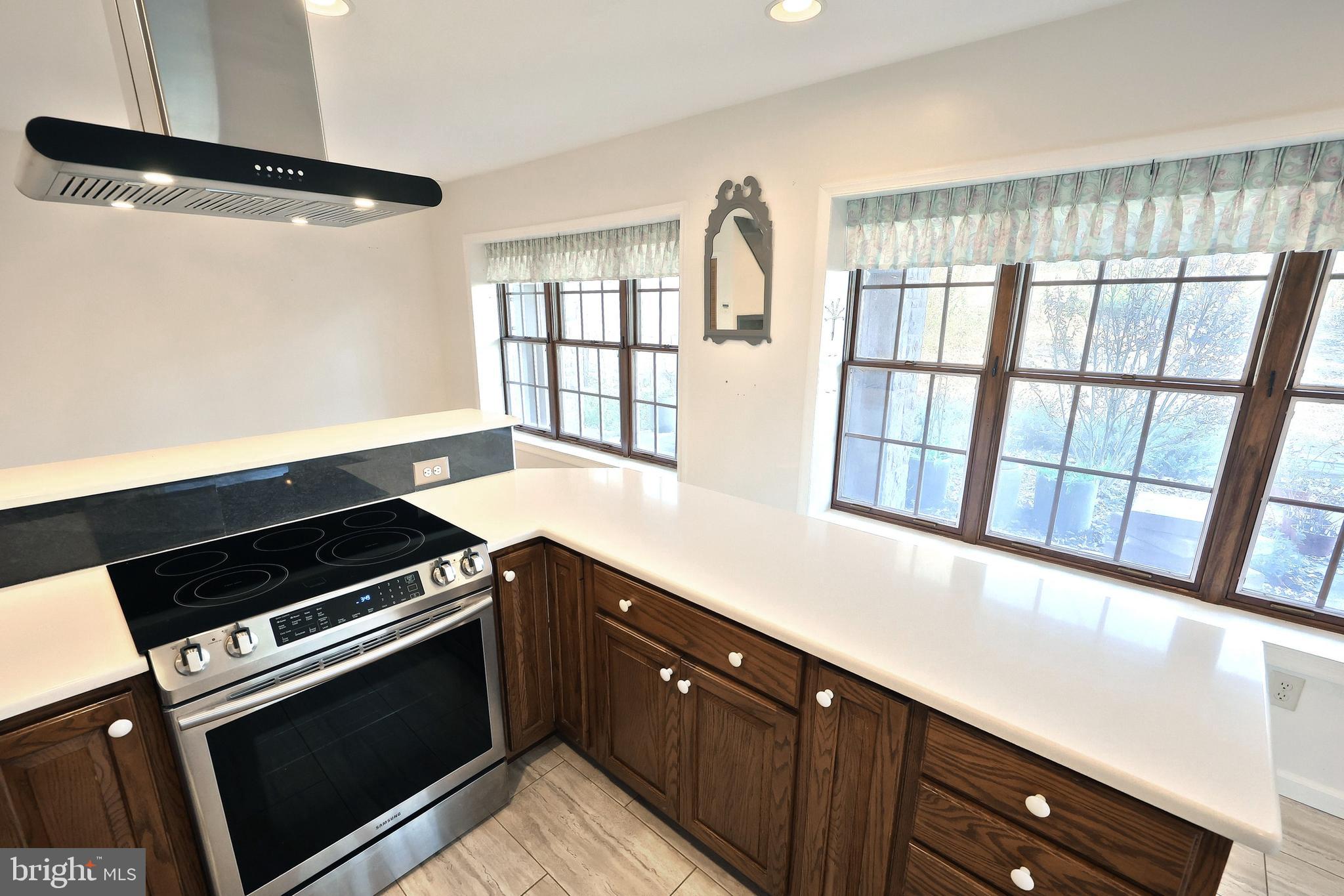 6691 Harmony Grove Road Dover, PA 17315 - Photo 32 of 66 a kitchen with a stove and a sink