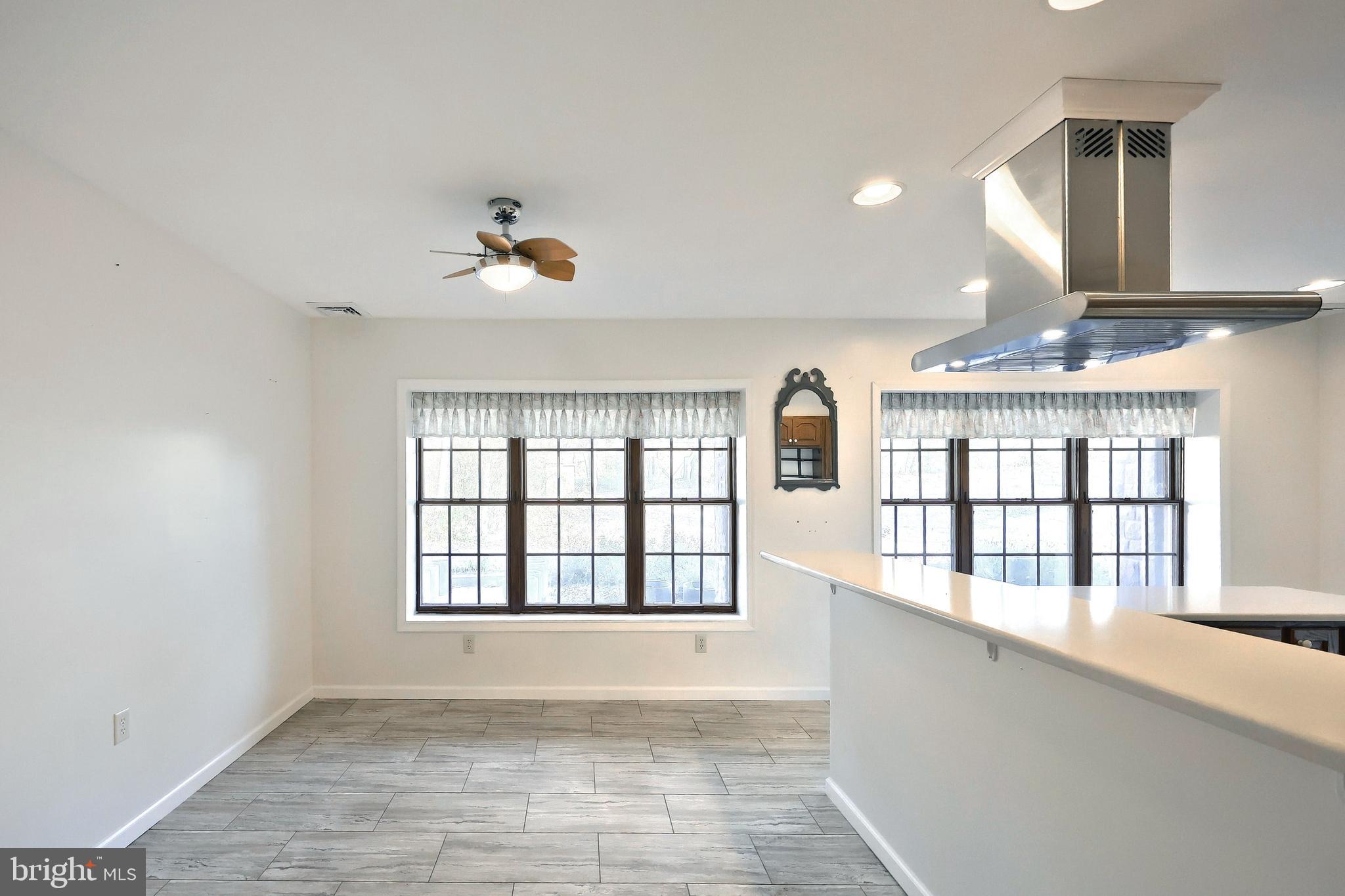 6691 Harmony Grove Road Dover, PA 17315 - Photo 33 of 66 wooden floor in an empty room with a window