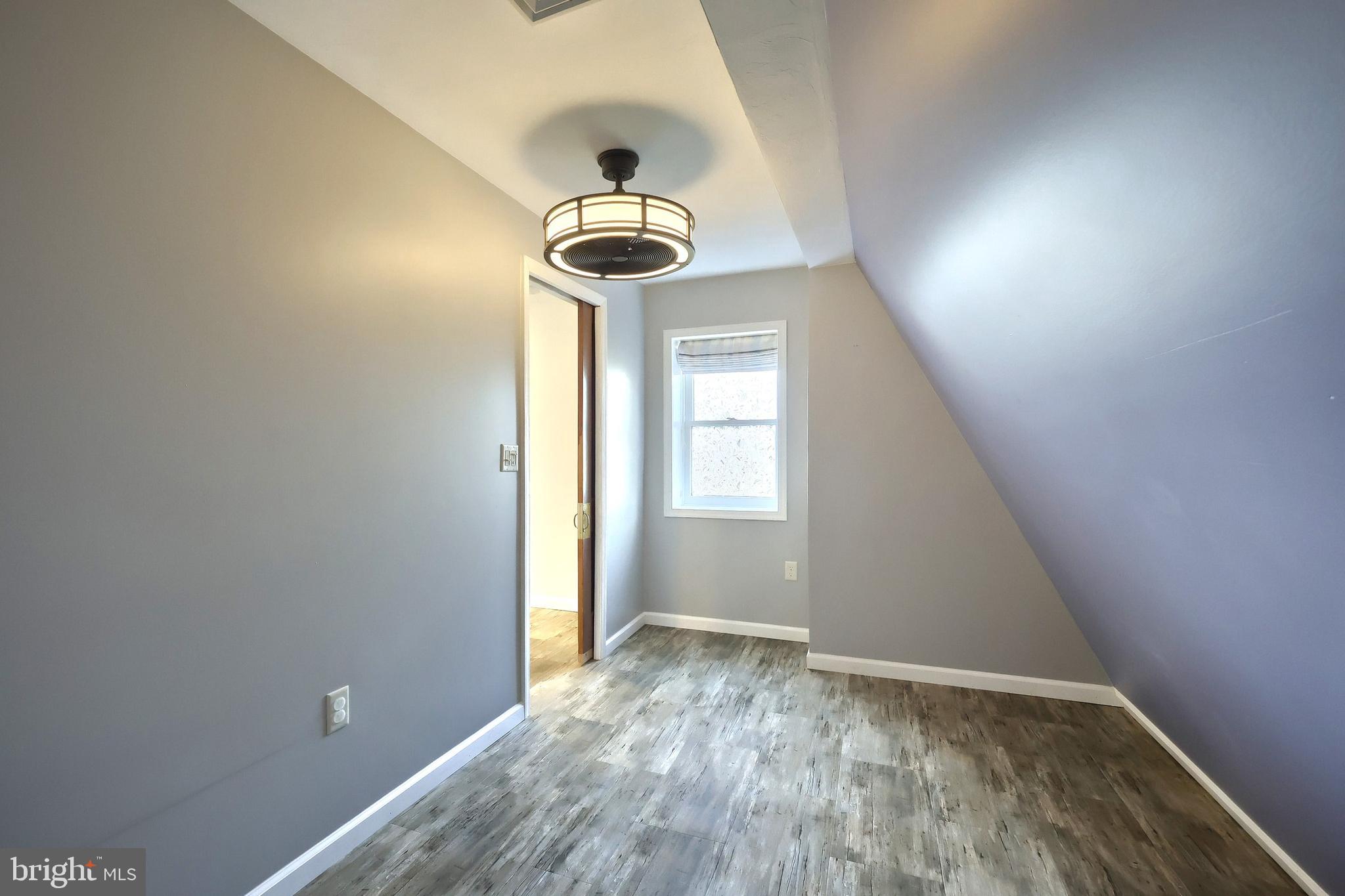 6691 Harmony Grove Road Dover, PA 17315 - Photo 35 of 66 a view of empty room with wooden floor