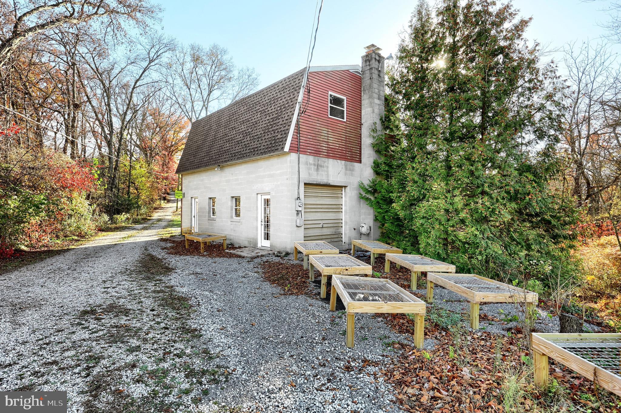 6691 Harmony Grove Road Dover, PA 17315 - Photo 41 of 66 a roof deck with a table and chairs under an umbrella