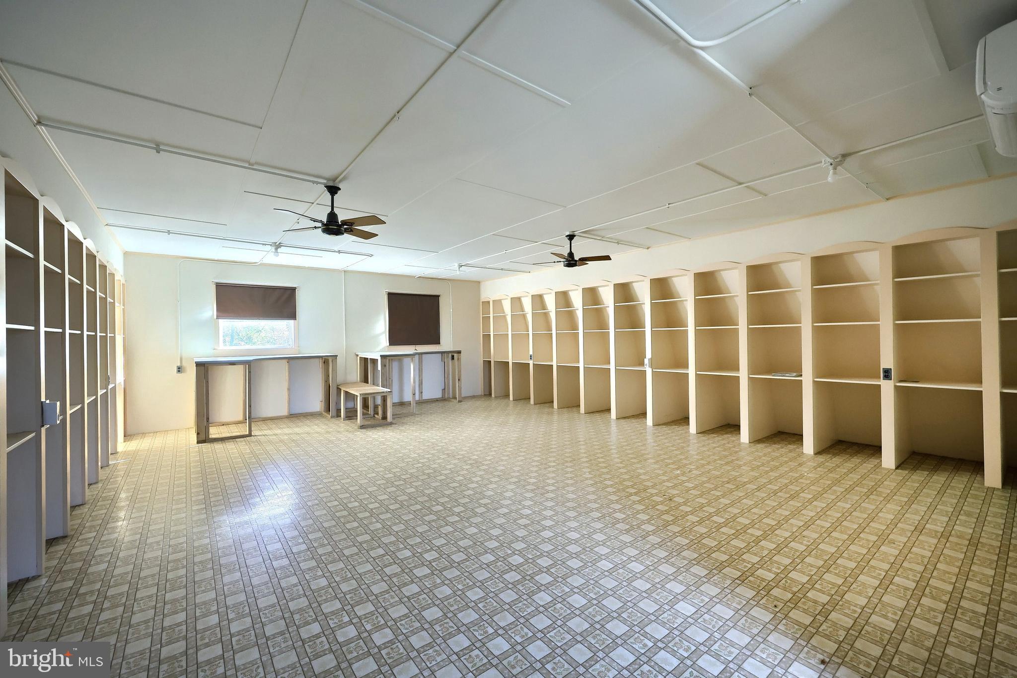 6691 Harmony Grove Road Dover, PA 17315 - Photo 44 of 66 a view of empty room with wooden floor and windows