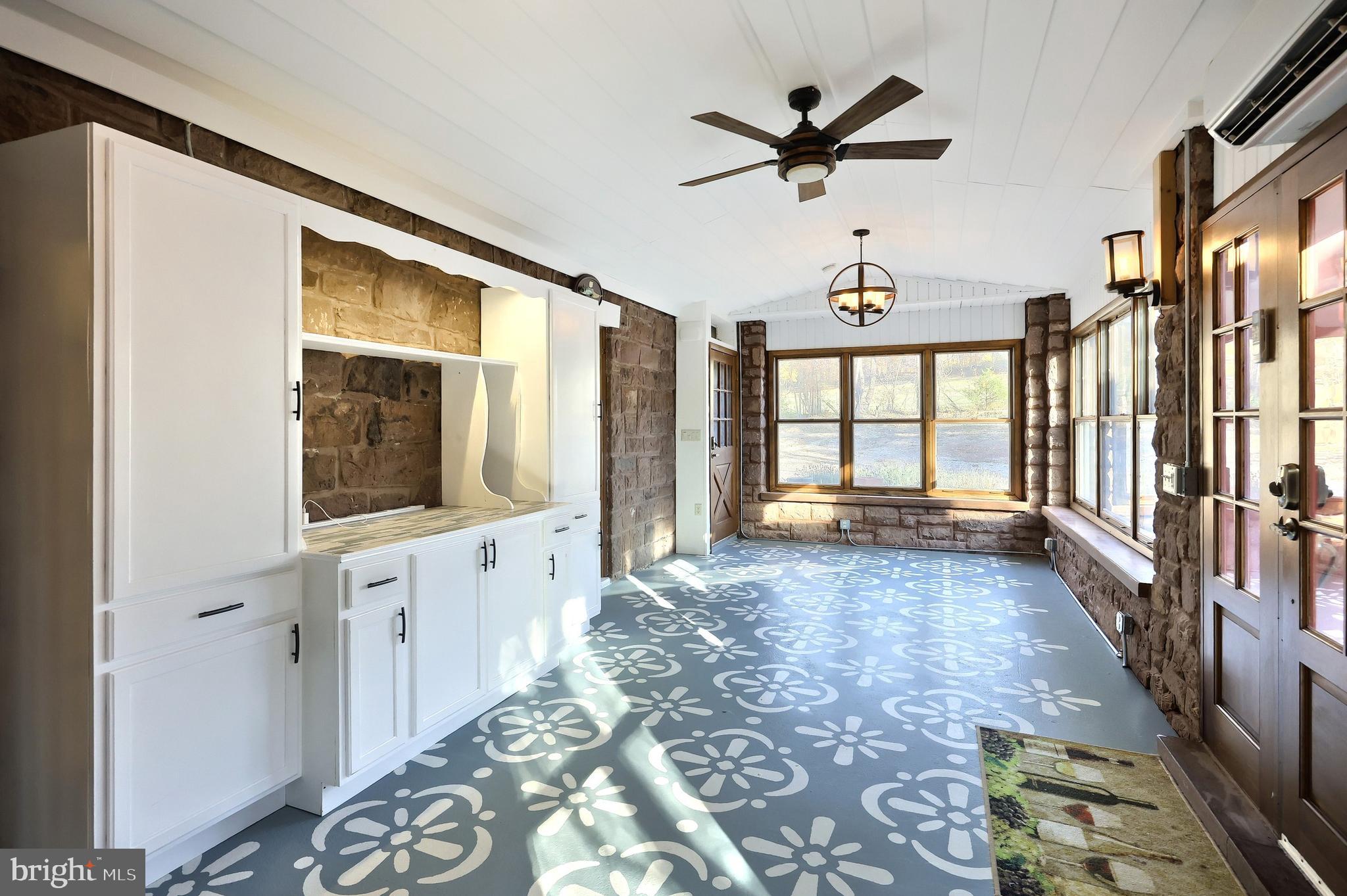 6691 Harmony Grove Road Dover, PA 17315 - Photo 9 of 66 a view of a hallway with windows
