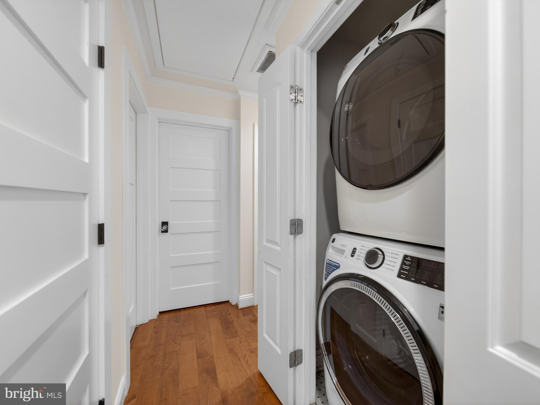 13427 Delaney Road Woodbridge, VA 22193 - Photo 31 of 57 a view of a hallway with washer and dryer