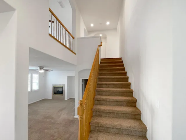 a view of entryway and hall with a front door