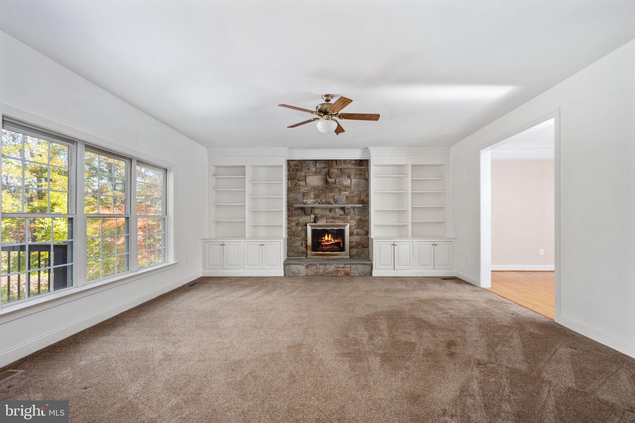 231 Kimberwick Lane Stafford, VA 22556 - Photo 17 of 78 an empty room with windows and fireplace