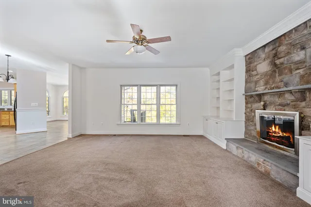 a kitchen with stainless steel appliances granite countertop a stove refrigerator and cabinets