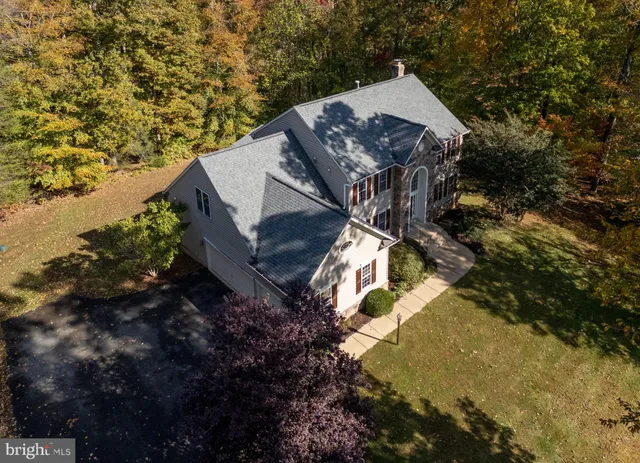 a view of an entryway with wooden floor and door