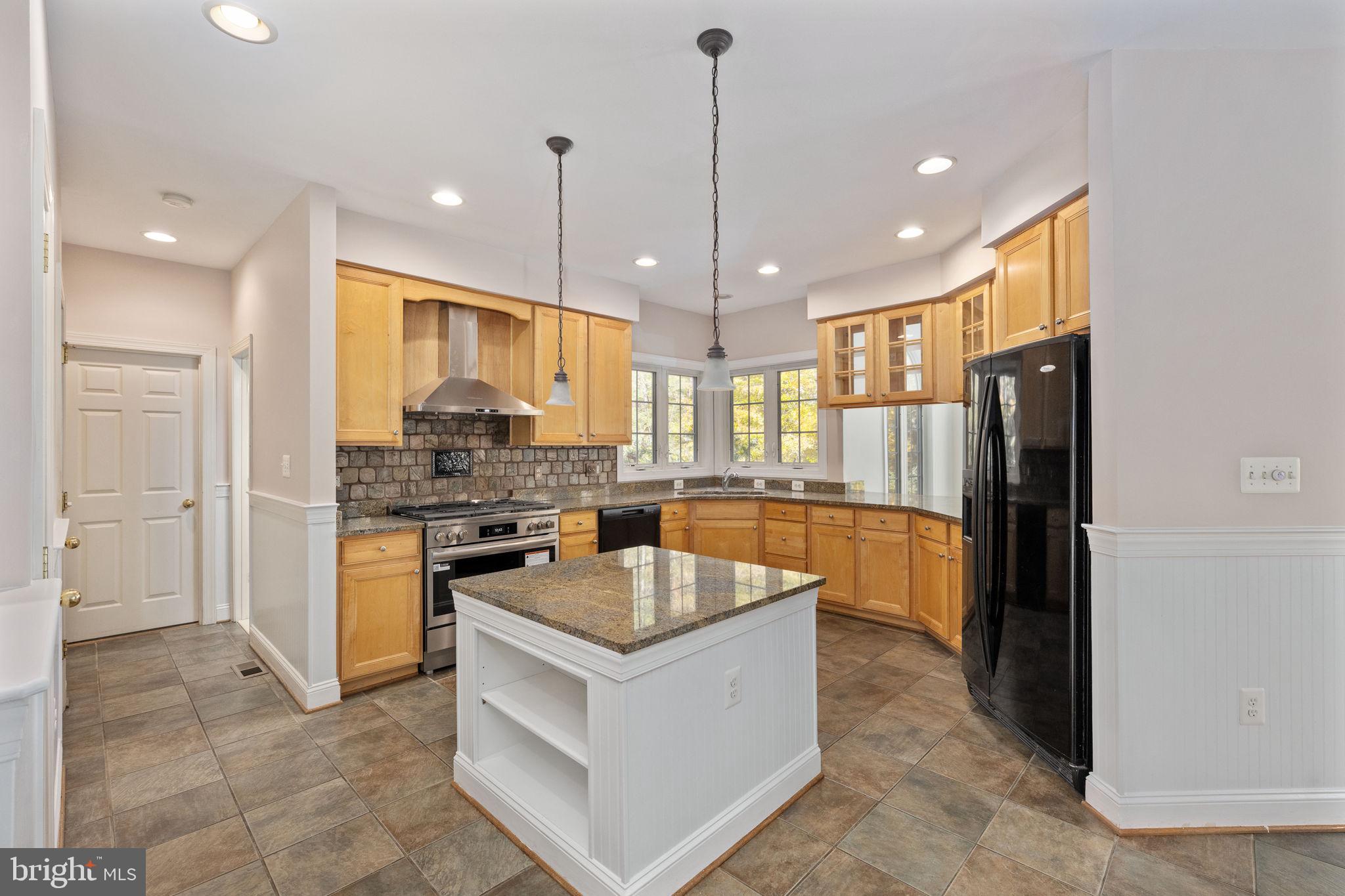 231 Kimberwick Lane Stafford, VA 22556 - Photo 21 of 78 a kitchen with stainless steel appliances granite countertop a refrigerator a sink a stove and oven