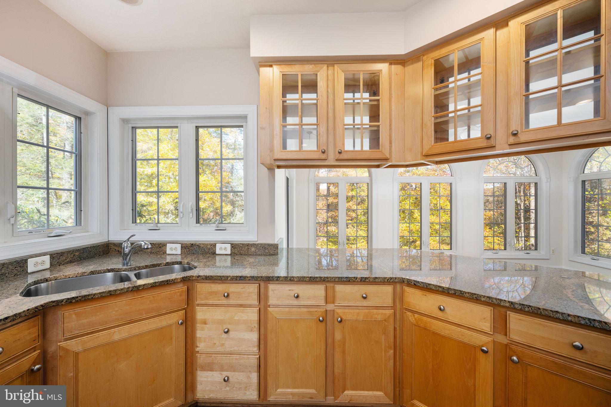 231 Kimberwick Lane Stafford, VA 22556 - Photo 25 of 78 a kitchen with stainless steel appliances granite countertop a sink and cabinets with wooden floors