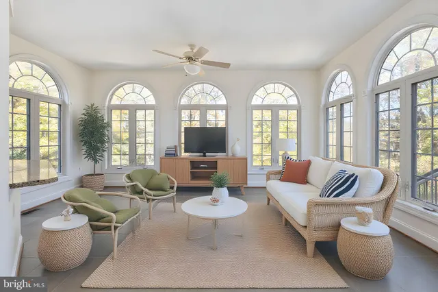 a white bath tub sitting next to a window