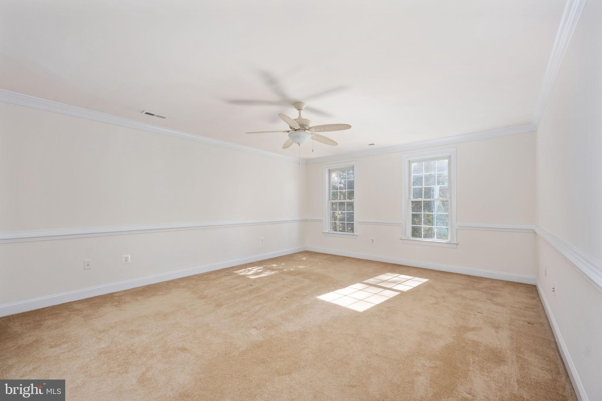 231 Kimberwick Lane Stafford, VA 22556 - Photo 41 of 78 an empty room with windows and ceiling fan