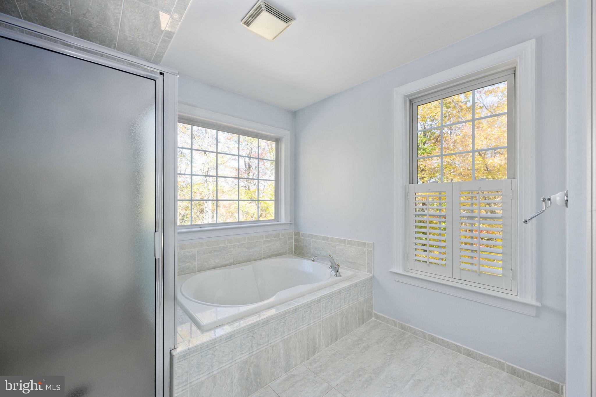 231 Kimberwick Lane Stafford, VA 22556 - Photo 45 of 78 a white bath tub sitting next to a window
