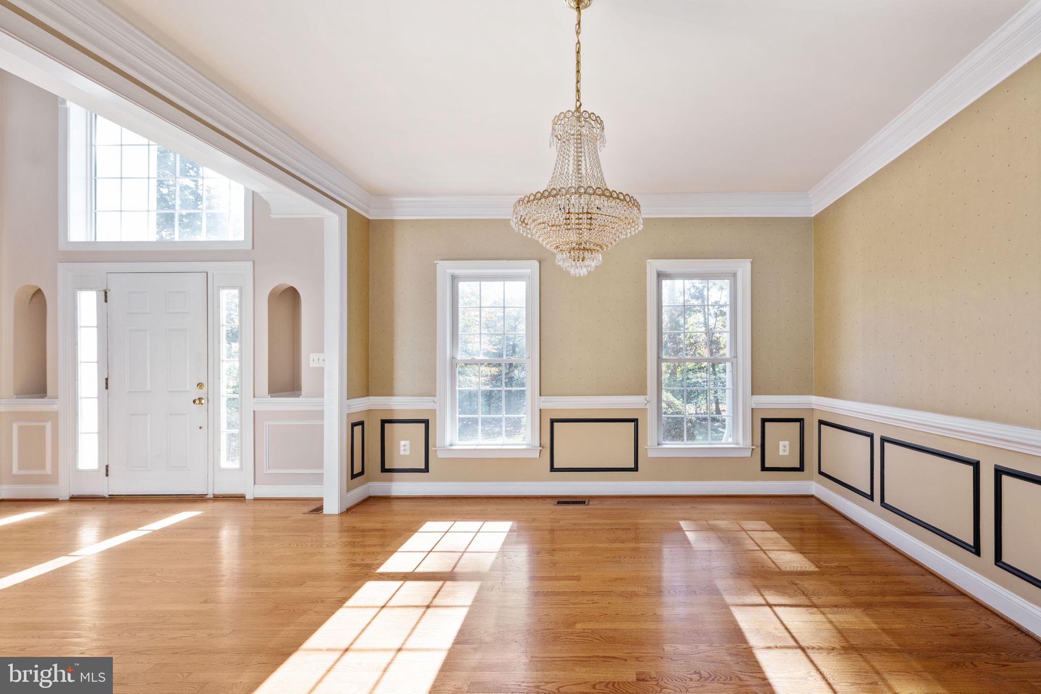231 Kimberwick Lane Stafford, VA 22556 - Photo 9 of 78 a view of a room with wooden floor windows and a chandelier
