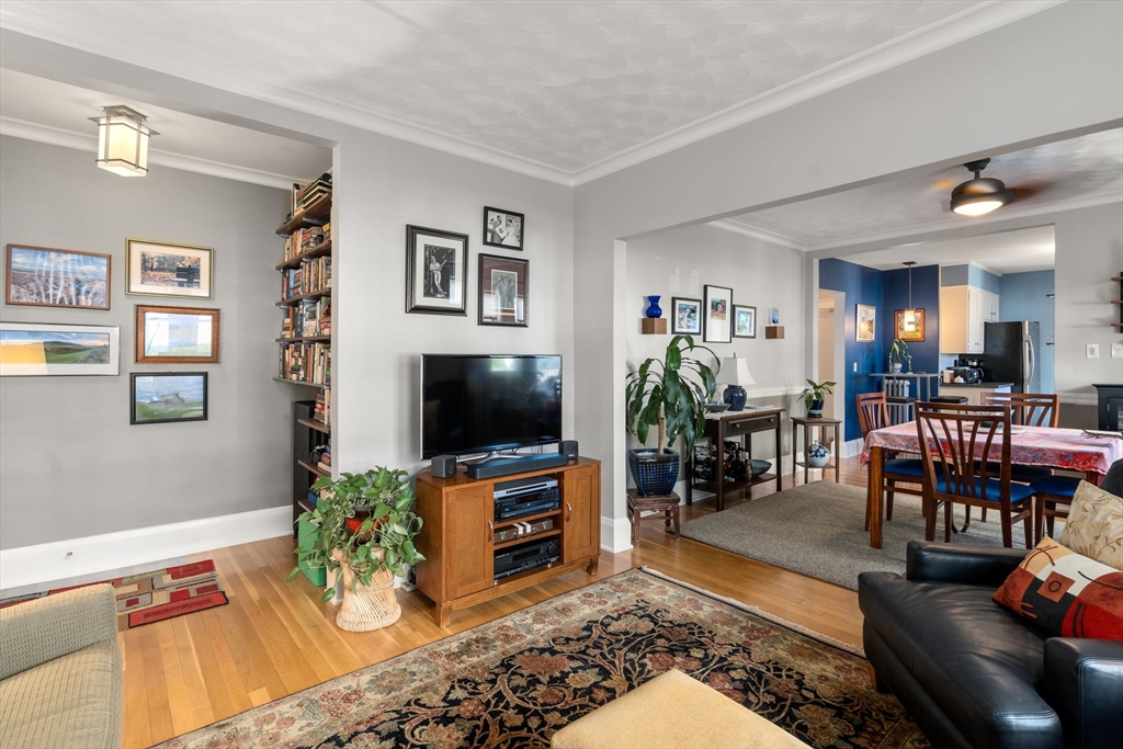 15 Berkshire Road, Unit 1 Waltham, MA 02453 - Photo 12 of 42 a living room with furniture and a flat screen tv