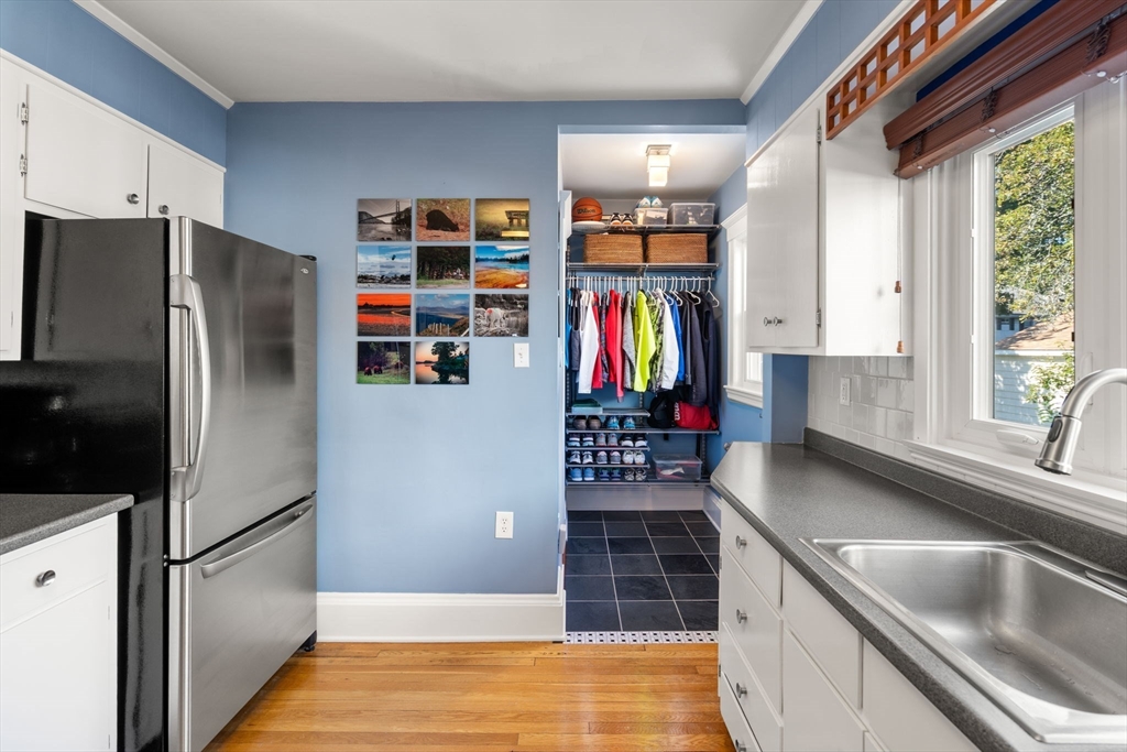 15 Berkshire Road, Unit 1 Waltham, MA 02453 - Photo 20 of 42 a kitchen with stainless steel appliances granite countertop a refrigerator and a sink