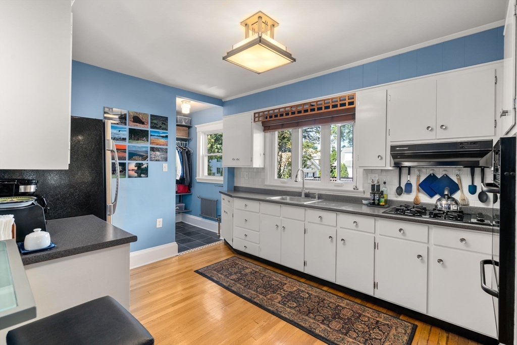 15 Berkshire Road, Unit 1 Waltham, MA 02453 - Photo 21 of 42 a kitchen with granite countertop lots of counter top space and windows