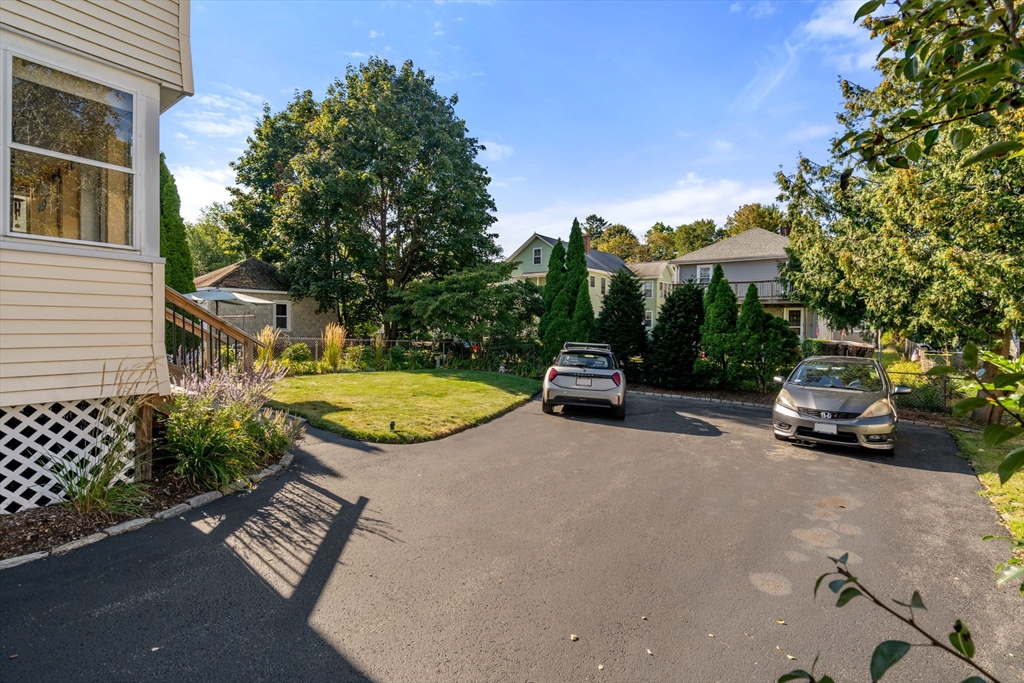 15 Berkshire Road, Unit 1 Waltham, MA 02453 - Photo 3 of 42 a view of a street with a car parked on the road