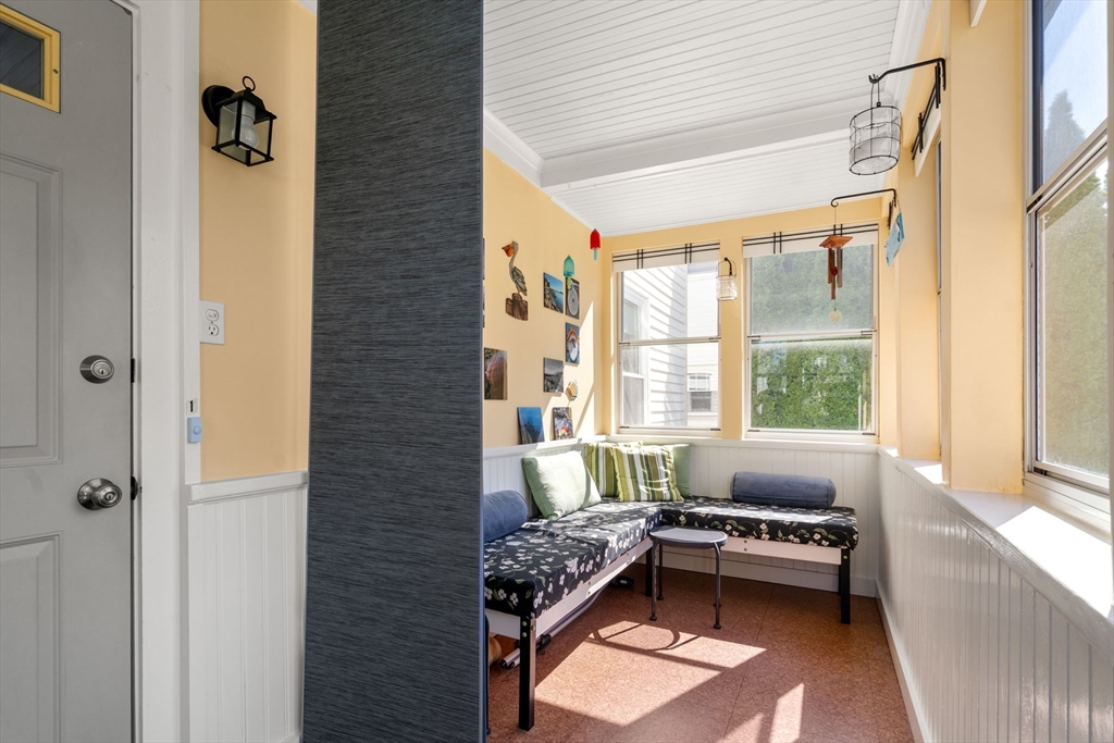 15 Berkshire Road, Unit 1 Waltham, MA 02453 - Photo 31 of 42 a living room with furniture and a window