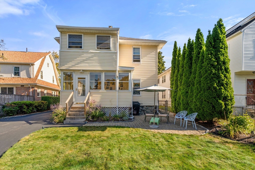 15 Berkshire Road, Unit 1 Waltham, MA 02453 - Photo 37 of 42 a view of a house with swimming pool and sitting area