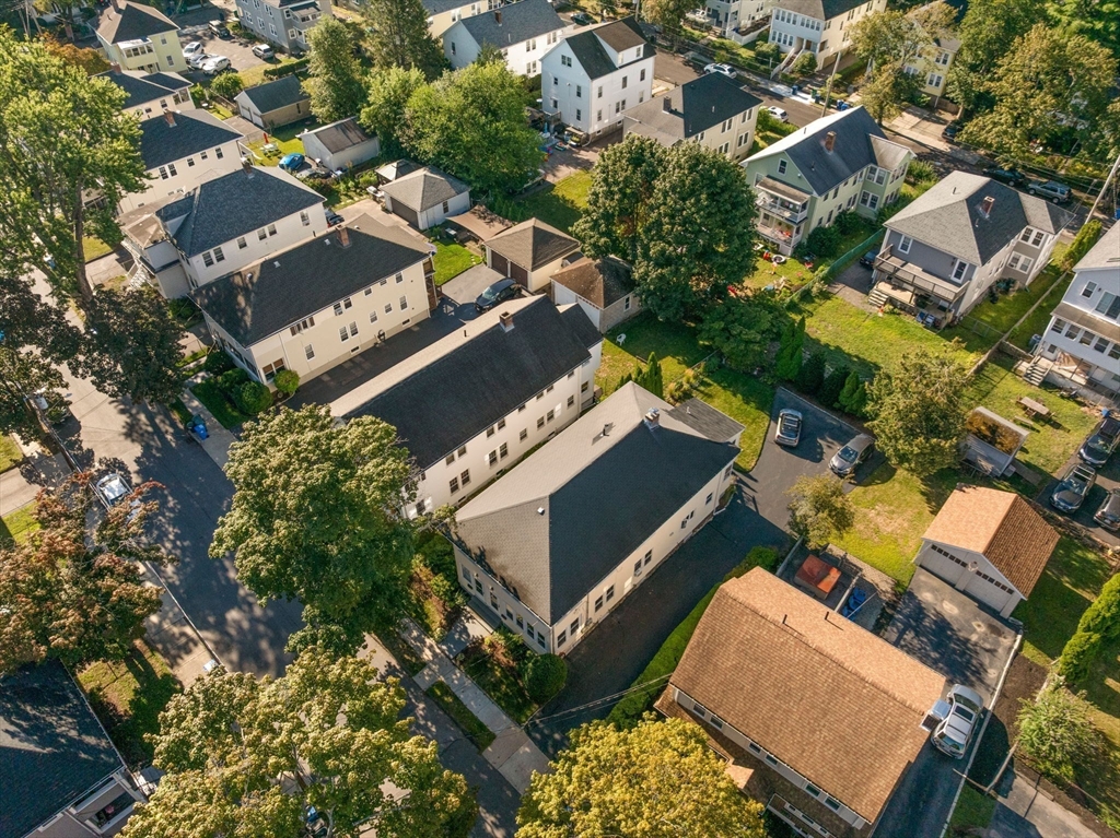 15 Berkshire Road, Unit 1 Waltham, MA 02453 - Photo 39 of 42 an aerial view of a house with a yard and street view
