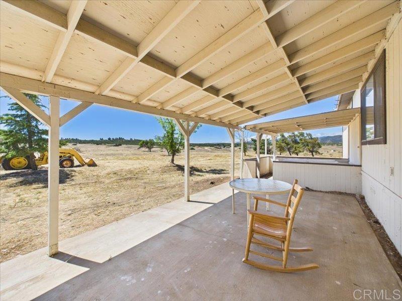 37589 Montezuma Valley Road Ranchita, CA 92066 - Photo 32 of 43 a view of a patio with a table and chairs next to a yard