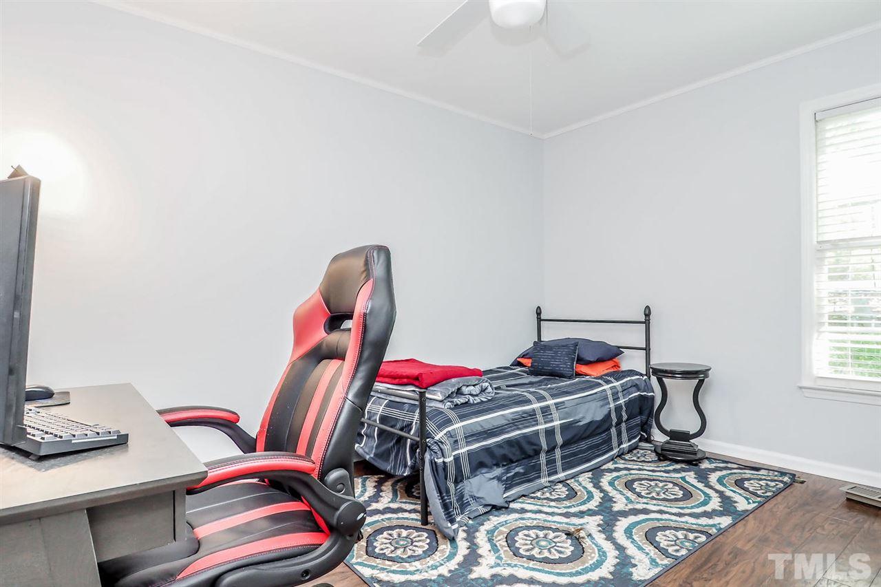 8821 Reigate Lane Raleigh, NC 27603 - Photo 14 of 23 a room with furniture and a window