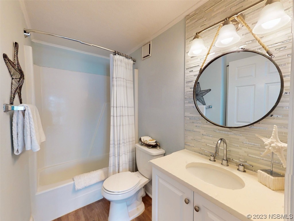 69 Sabal Cay Court, Unit 690 New Smyrna Beach, FL 32169 - Photo 11 of 30 a bathroom with a sink toilet and a mirror
