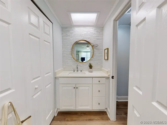 a bathroom with a sink and a mirror