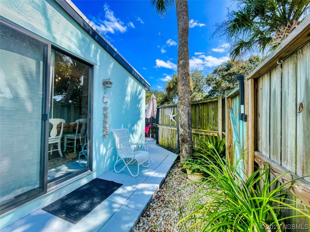 69 Sabal Cay Court, Unit 690 New Smyrna Beach, FL 32169 - Photo 17 of 30 a porch with seating space