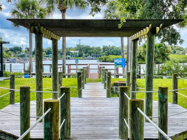 a view of balcony with chairs and wooden fence