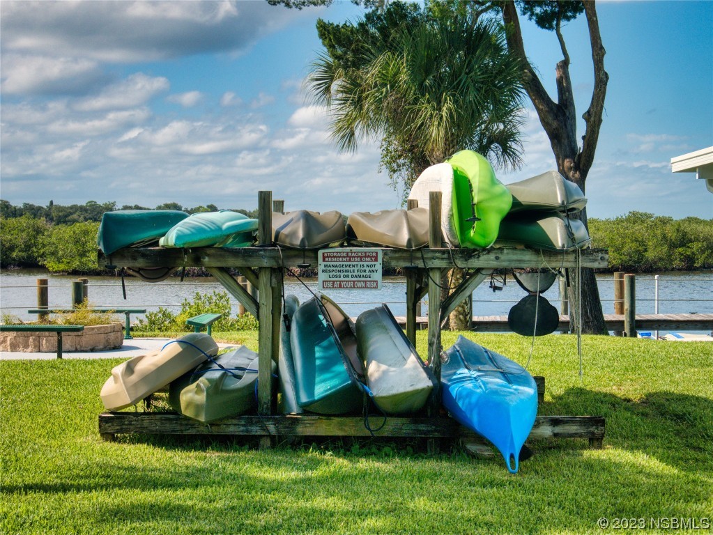 69 Sabal Cay Court, Unit 690 New Smyrna Beach, FL 32169 - Photo 25 of 30 an aerial view of a house with swimming pool garden and patio