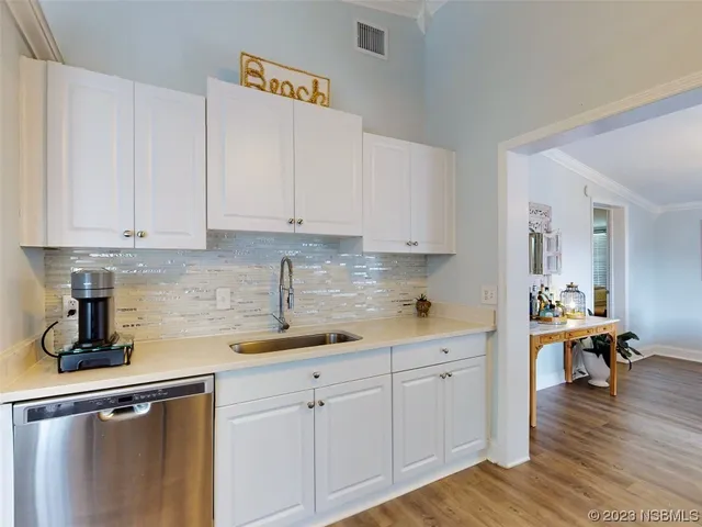 a kitchen with a sink and cabinets