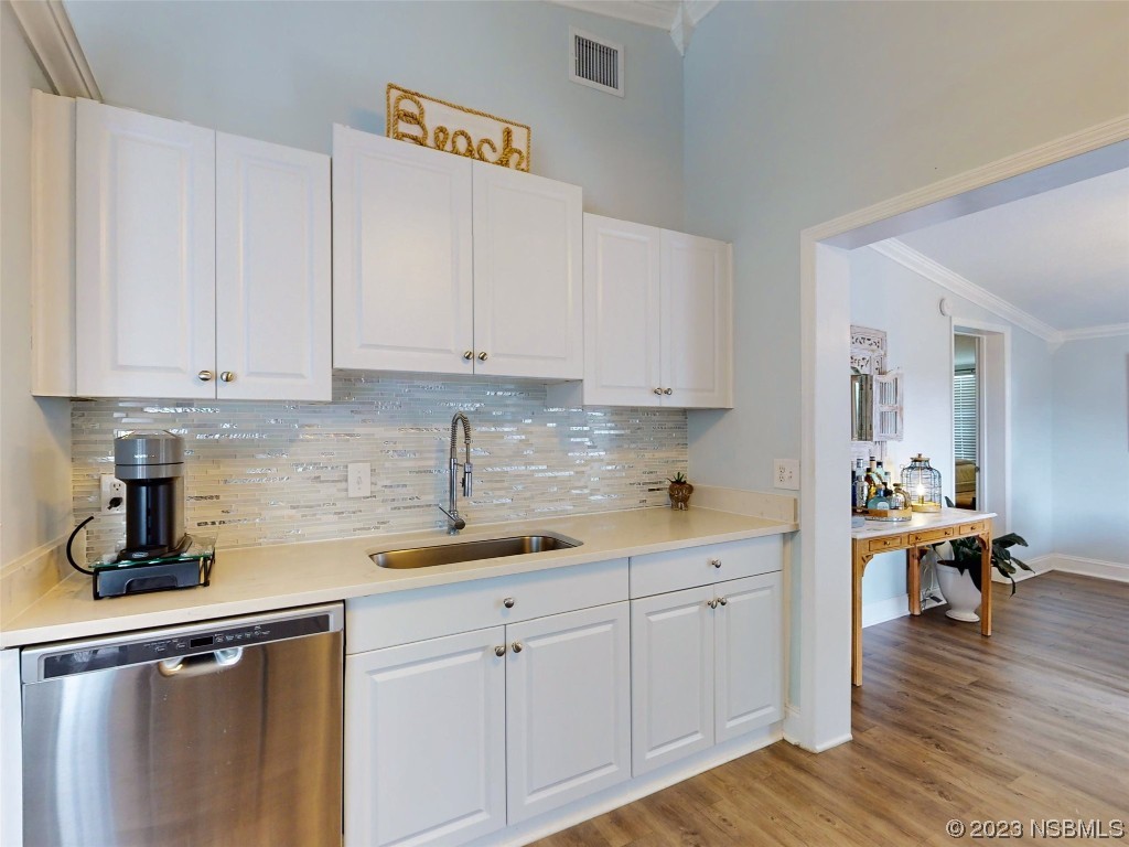 69 Sabal Cay Court, Unit 690 New Smyrna Beach, FL 32169 - Photo 6 of 30 a kitchen with a sink and cabinets
