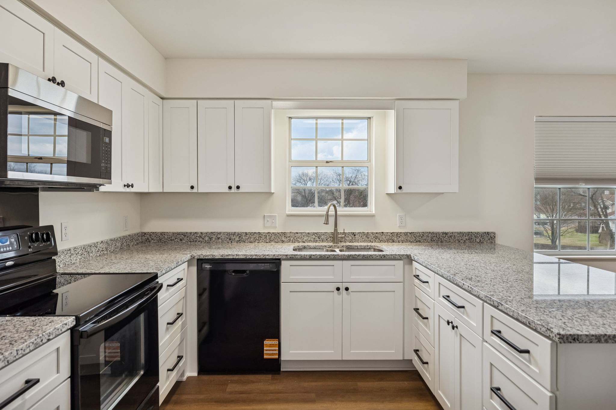 1108 Jacksons View Road Hermitage, TN 37076 - Photo 11 of 36 a kitchen with stainless steel appliances granite countertop a sink stove and cabinets