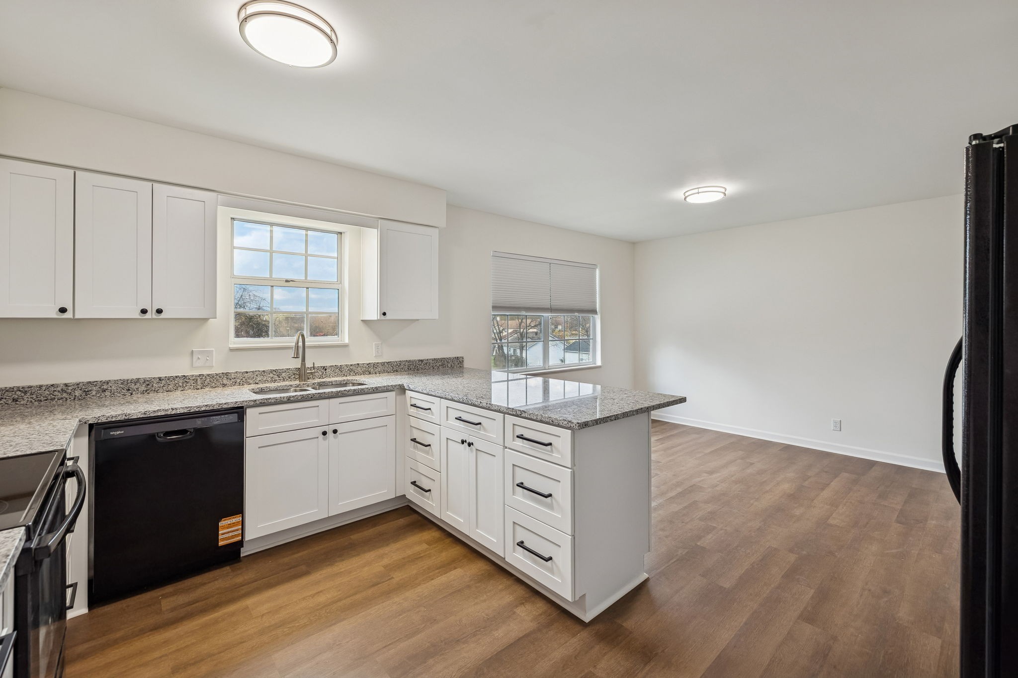 1108 Jacksons View Road Hermitage, TN 37076 - Photo 12 of 36 a kitchen with stainless steel appliances granite countertop a stove a sink and white cabinets