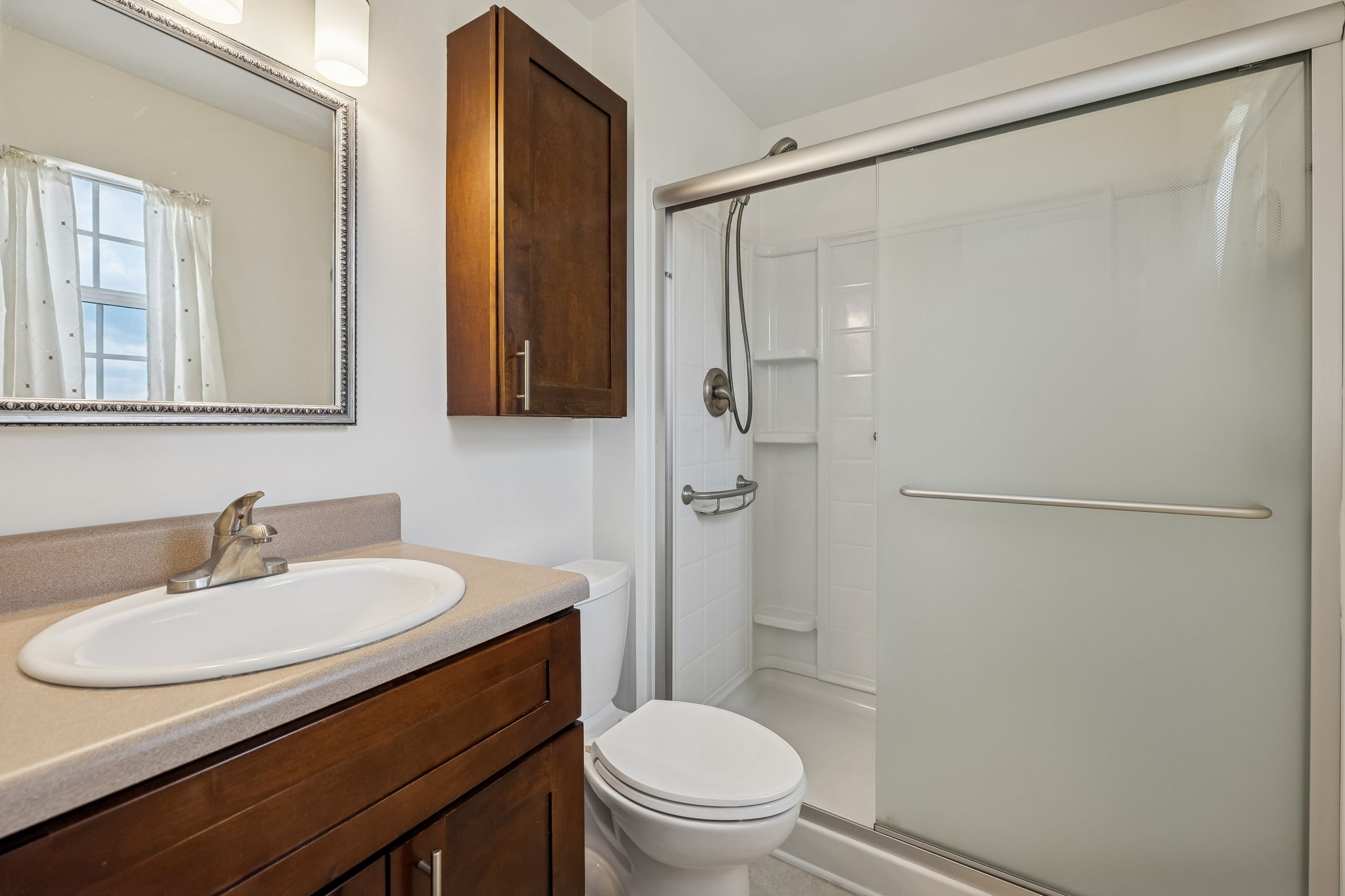 1108 Jacksons View Road Hermitage, TN 37076 - Photo 16 of 36 a bathroom with a sink toilet and shower