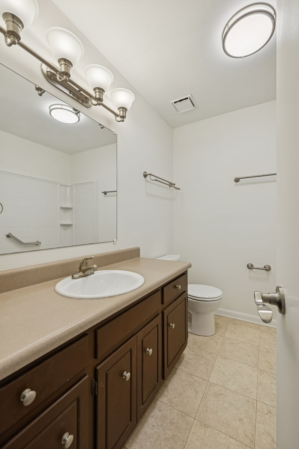 1108 Jacksons View Road Hermitage, TN 37076 - Photo 20 of 36 a bathroom with a granite countertop toilet sink and mirror
