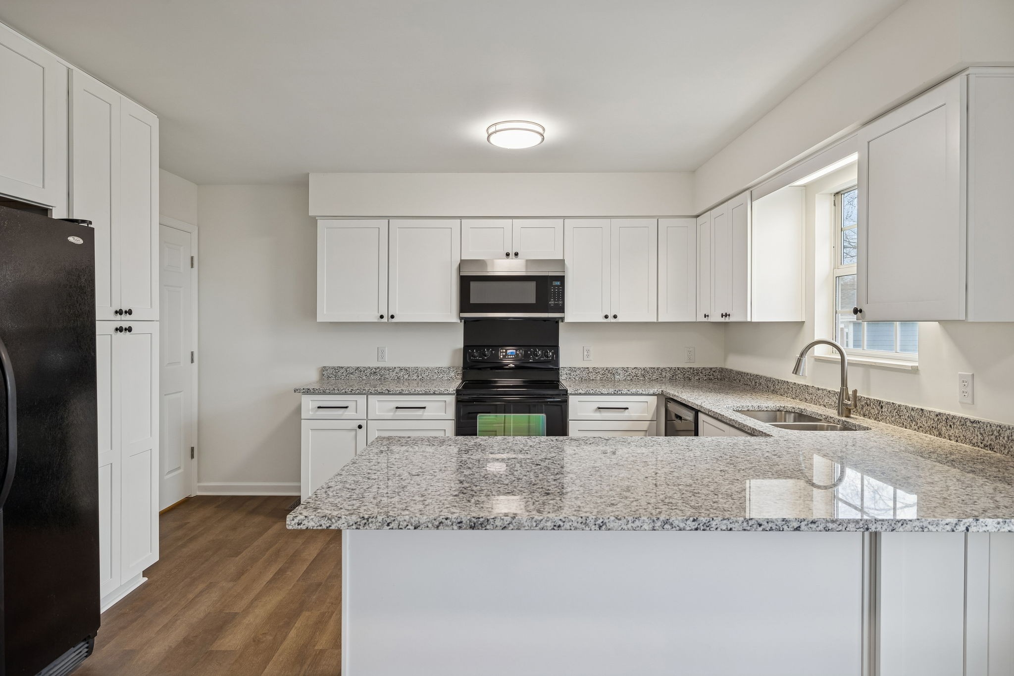 1108 Jacksons View Road Hermitage, TN 37076 - Photo 9 of 36 a kitchen with stainless steel appliances granite countertop a sink stove and refrigerator