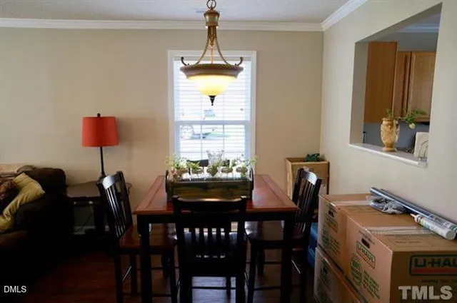 a dining room with furniture and window