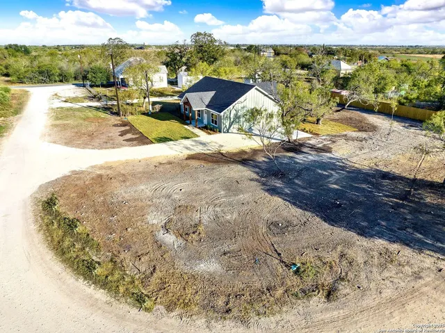 a view of swimming pool with lawn chairs