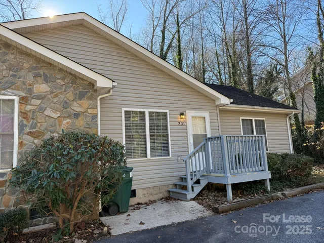 a view of backyard with a garden and deck