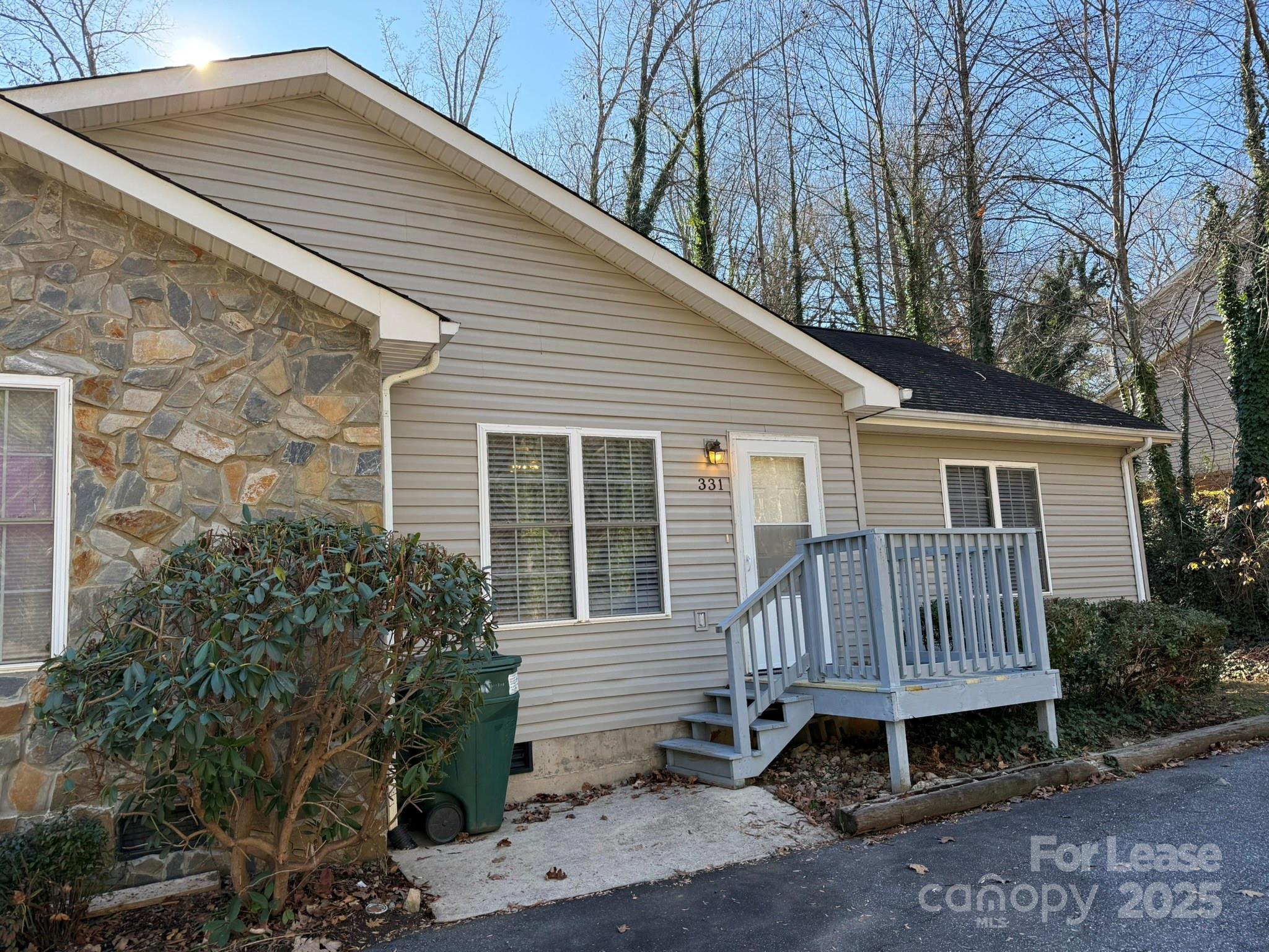 a view of backyard with a garden and deck