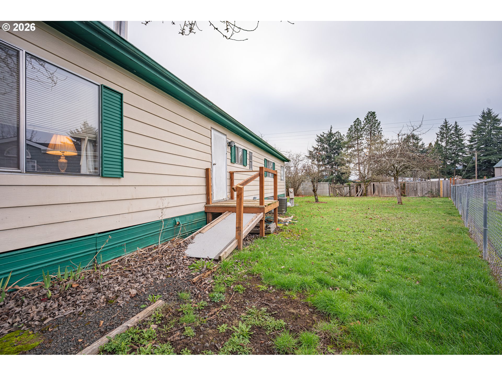 3393 Snow Peak Place Lebanon, OR 97355 - Photo 4 of 13 a view of a backyard with a garden