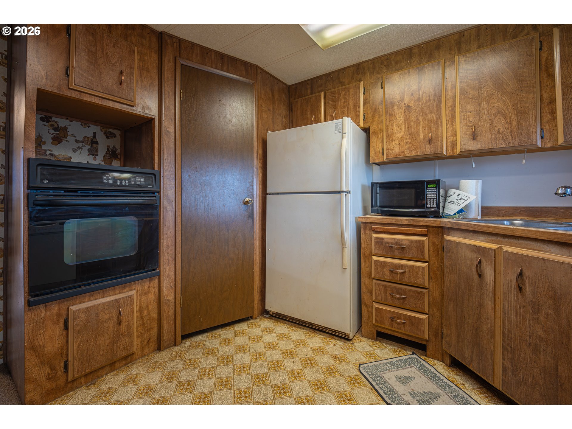3393 Snow Peak Place Lebanon, OR 97355 - Photo 10 of 13 a kitchen with cabinets and stainless steel appliances