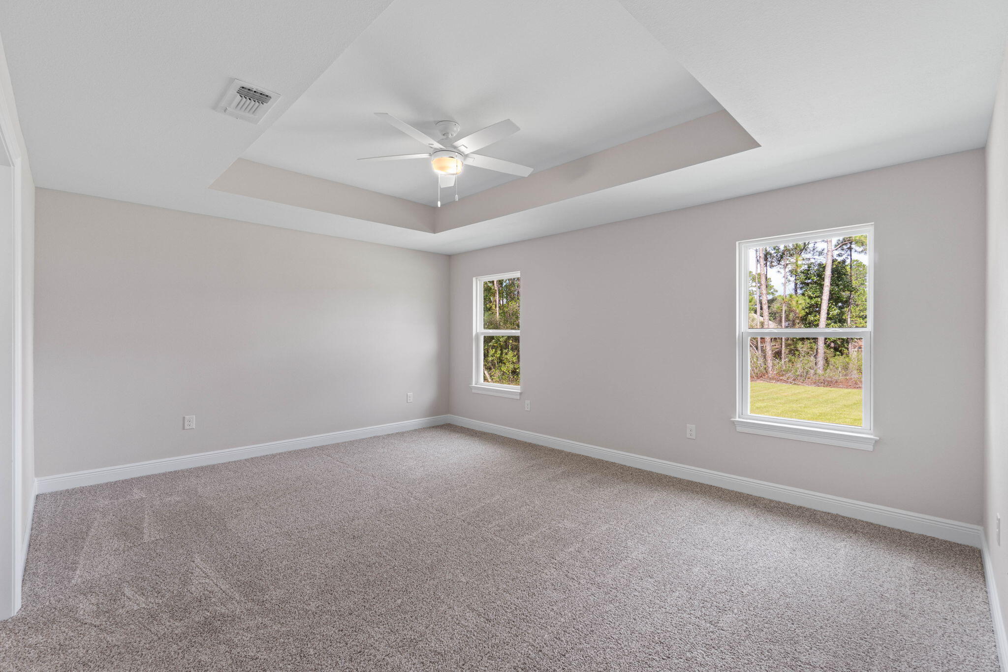 6752 Redfield Street Navarre, FL 32566 - Photo 21 of 64 an empty room with windows and fan