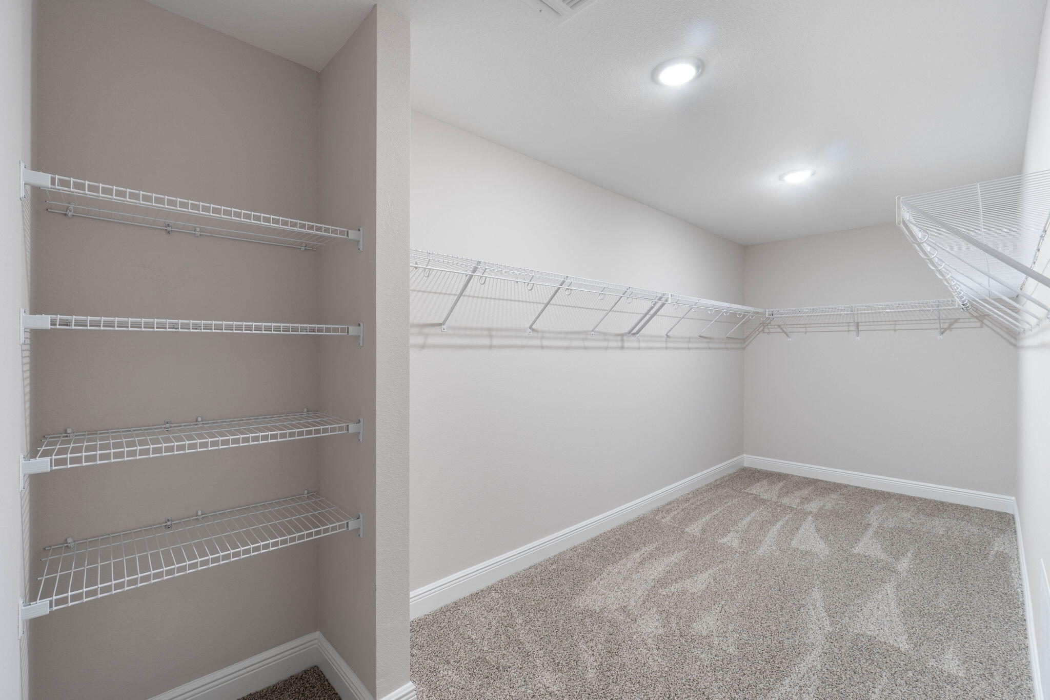 6752 Redfield Street Navarre, FL 32566 - Photo 23 of 64 a view of a room with racks on the wall