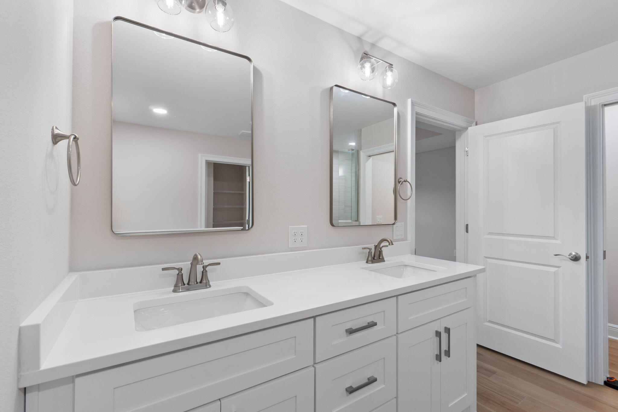 6752 Redfield Street Navarre, FL 32566 - Photo 26 of 64 a bathroom with double sink and a mirror